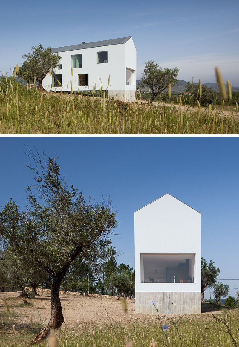 House Exterior Colors - 11 Modern White Houses From Around The World // Large windows on this bright white house ensure that the inside is just as bright as the outside.