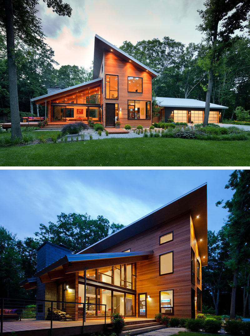 16 Examples Of Modern Houses With A Sloped Roof | The sloped roofs on this wood-clad modern home promote excellent drainage and open up the house to allow to take advantage of the greenery around it.