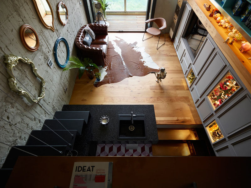 Interior Design Ideas - 17 Modern Living Rooms As Seen From Above | The kitchen and living room of this small apartment are connected to each other thanks to the open concept design making it easy to cook and entertain at the same time.