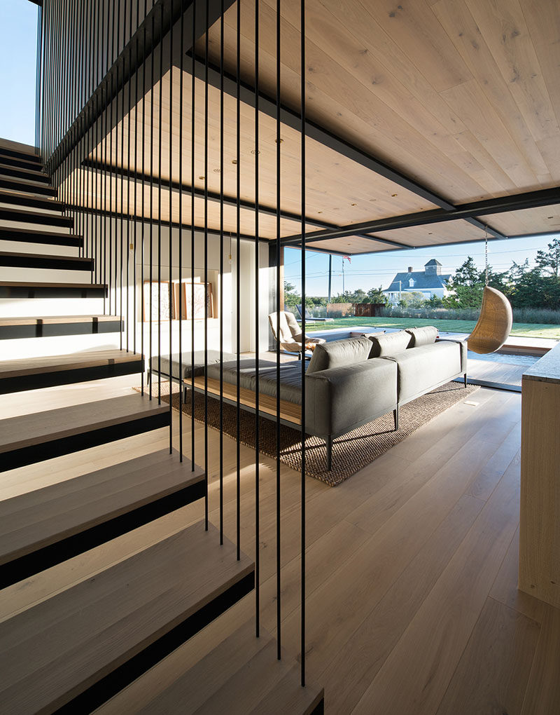 The color palette in this home has been kept neutral with earthy tones that tie in with the wooden ceiling.