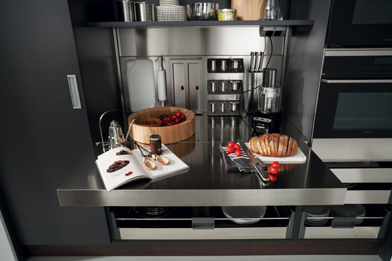 Kitchen Design Idea - Pull-Out Counters (10 Pictures) // The stainless steel surface of this work space can be pulled out to nearly double the amount of prep space you have.