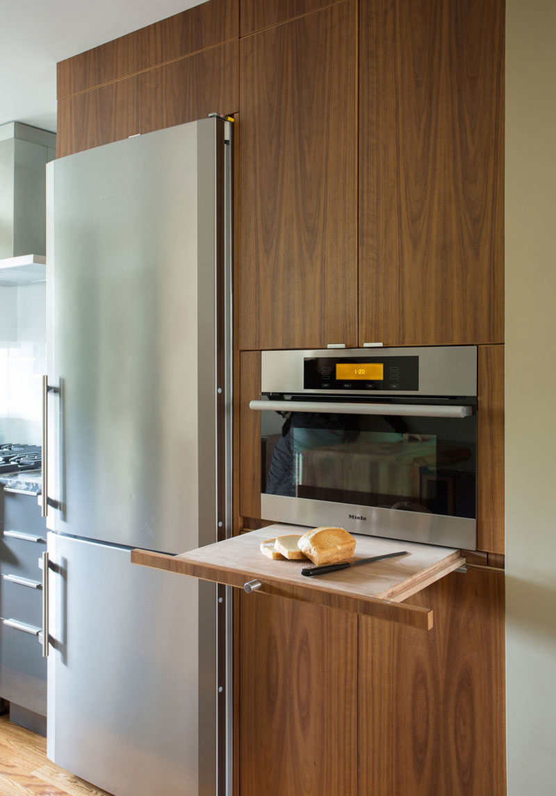 Kitchen Design Idea - Pull-Out Counters (10 Pictures) // A wooden pull-out counter also acts as the perfect spot for an additional cutting board.