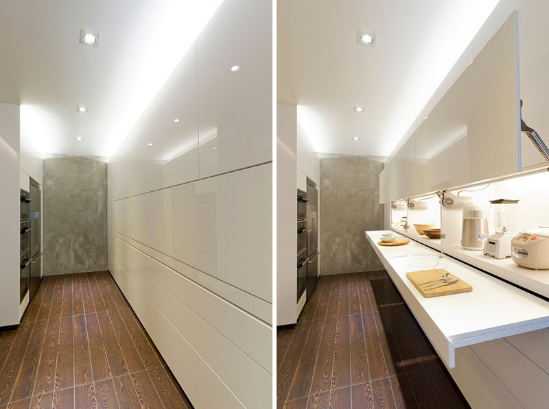 Kitchen Design Idea - Pull-Out Counters (10 Pictures) // In this white streamline kitchen, the countertops are completely hidden until needed.