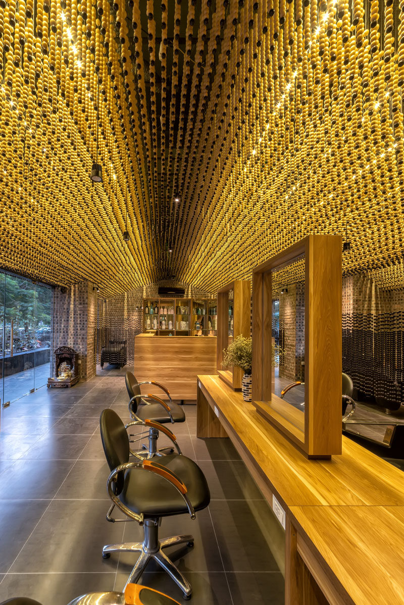 Ceiling Design Ideas - 200,000 Wood Beads Cover The Ceiling In This Hair Salon