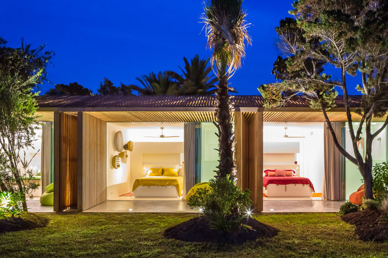 This modern villa has side-by-side bedrooms decorated with specific colors.