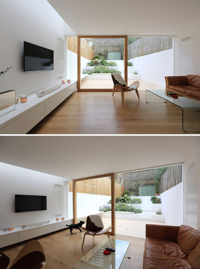 A Bright White Dining Room Extension And Landscaped Terraced Backyard Were Added To This East London Home