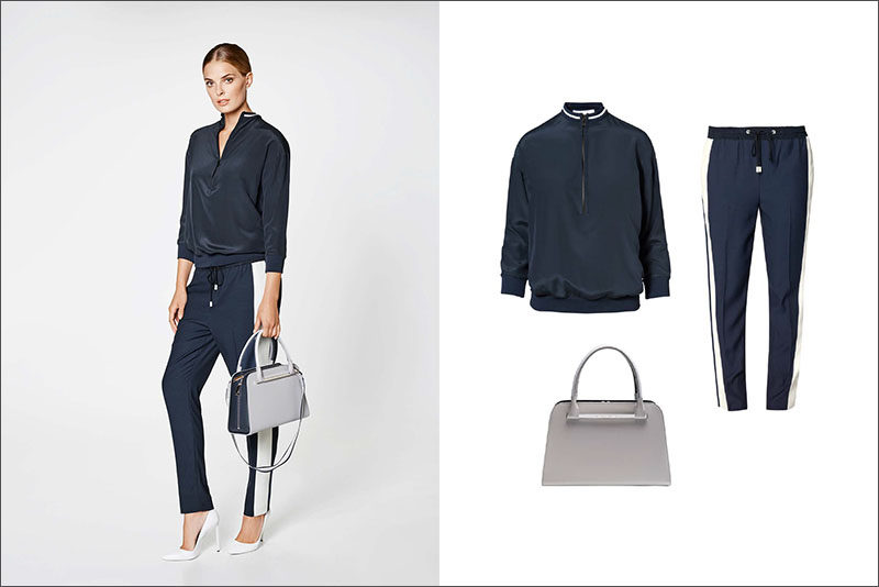 Women's Fashion Ideas - 12 Womens Outfits From Porsche Design's 2017 Spring/Summer Collection // This casual women's outfit features a navy blouse, a pair of navy and white pants, and a classic grey and navy purse.