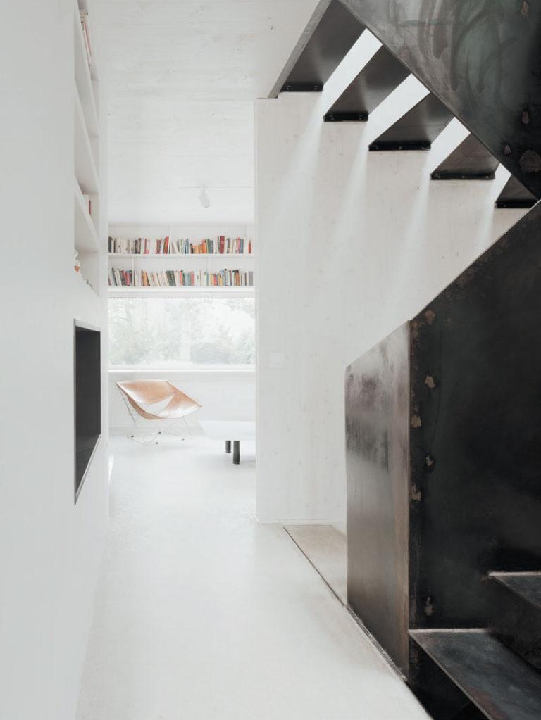 An angular exterior surrounds the minimalist interior of this house in ...