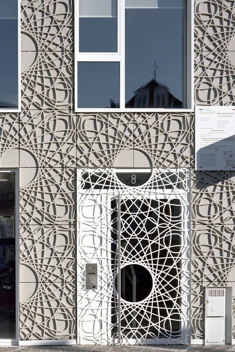 This building facade is made up of decorative concrete panels inspired by a pattern found on bank notes.