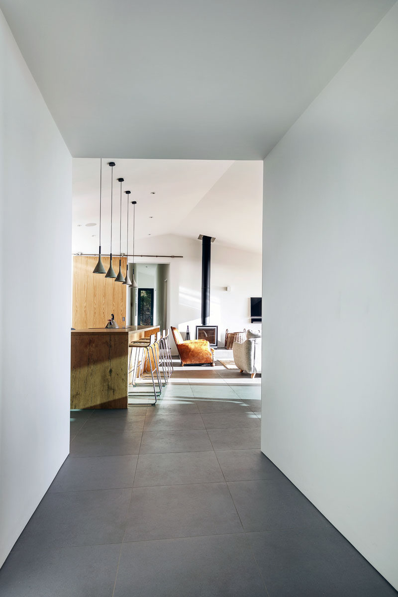 Large dark grey tiles cover the floor of the home and give the interior a cohesive appearance.