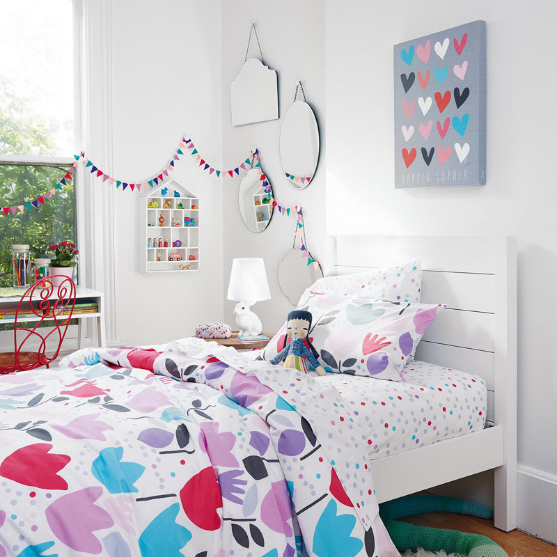 When decorating a bedroom for a little girl, create a fun color palette or purples, greys, pinks and blues.