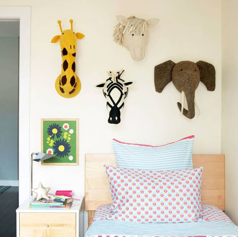 Use fun stuffed animal heads as a cute way to decorate a little girls bedroom.