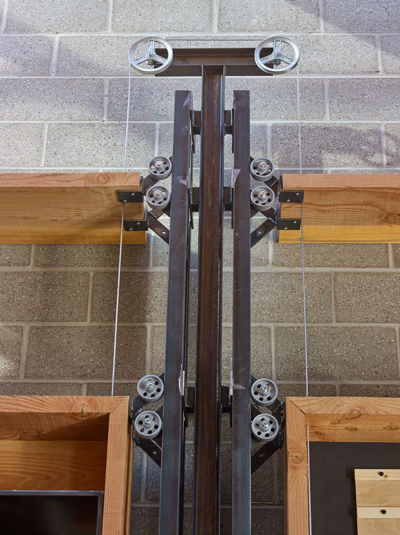 This wheel and pulley system adds an industrial design detail to a brew pub and restaurant.