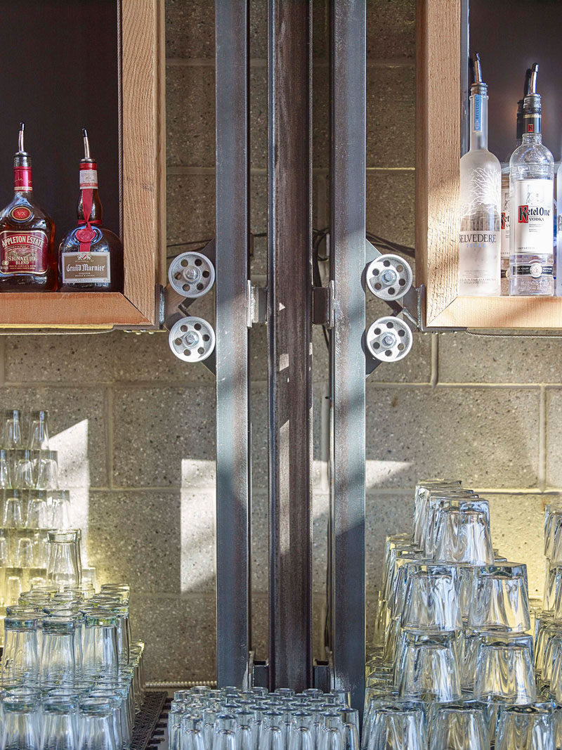 This wheel and pulley system adds an industrial design detail to a brew pub and restaurant.