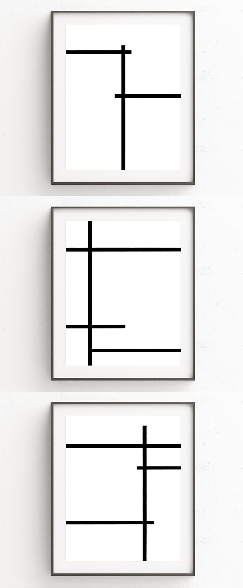 Oju Design has created this collection of 3 minimalist art prints that use bold black lines to break up the all white background.