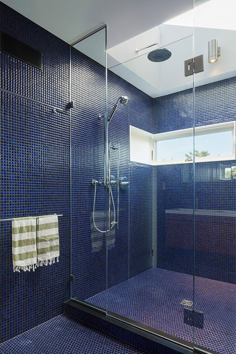 Bathroom Tile Idea - Use The Same Tile On The Floors And The Walls | These small blue tiles covering the floor and the walls give the bathroom a textured look and replace the need for colored paint.