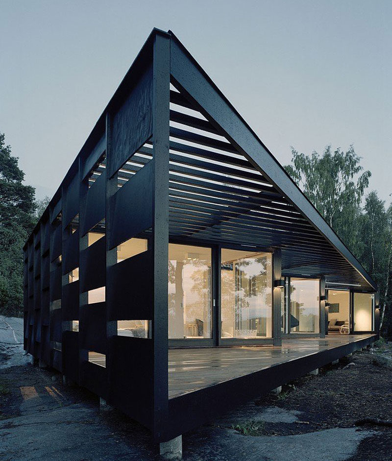 House Exterior Colors – 14 Modern Black Houses From Around The World / Black wood panels with wide openings on the exterior of this home give a modern look and let in lots of natural light.