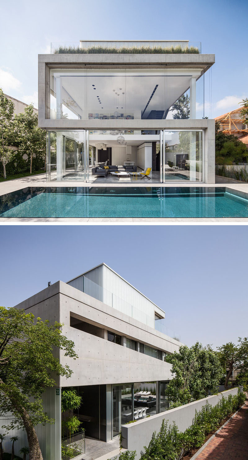 13 Modern House Exteriors Made From Concrete | Concrete and glass have been used for the design of this modern home to keep it bright, airy, and open.