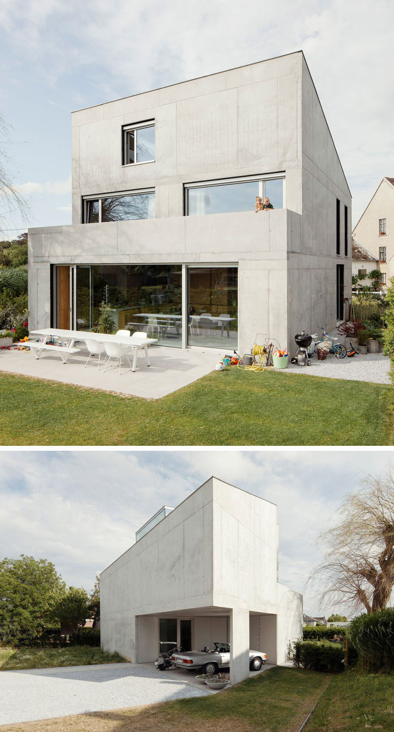 13 Modern House Exteriors Made From Concrete | The solid concrete wall at the front of this house is a strong contrast to the more open back of the home.