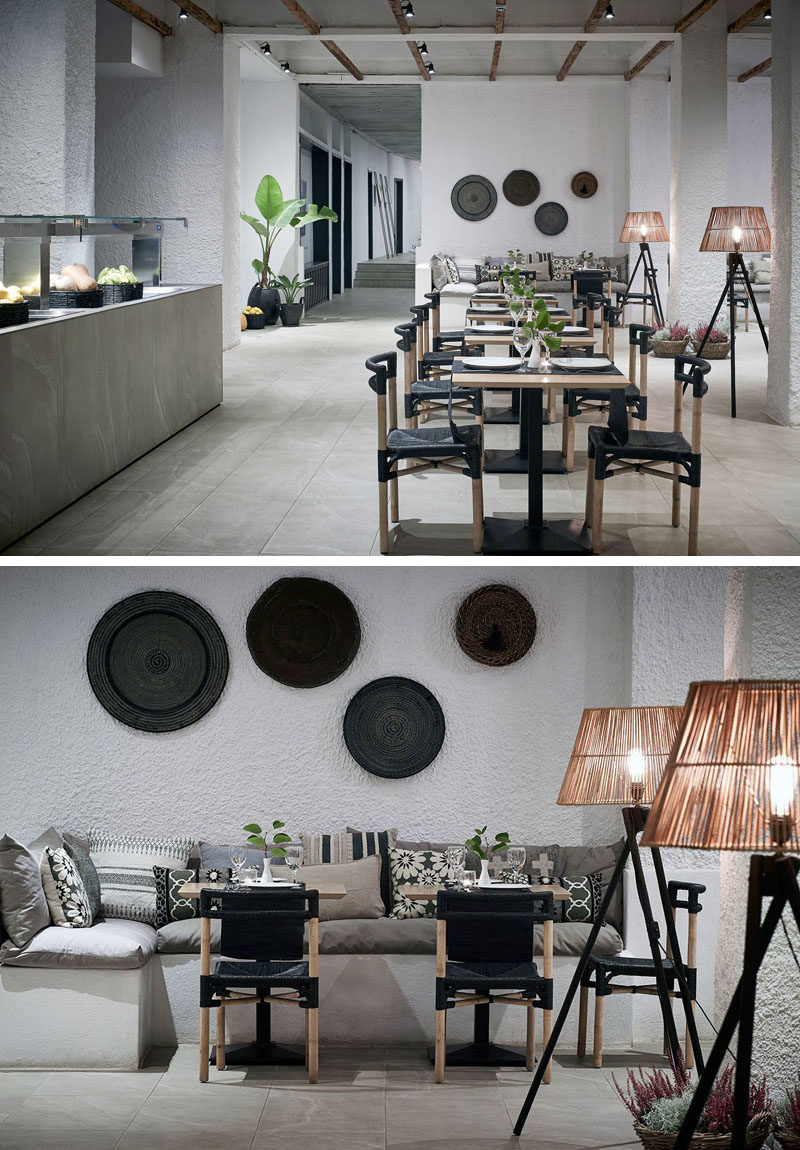 This modern hotel restaurant has both indoor and outdoor seating, and in keeping with the rest of the hotel design, has a simple interior of white textured walls, banquette seating, stone floors, and natural elements throughout.