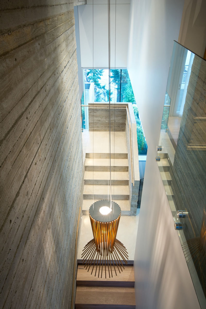 Board formed concrete used on the interior of this modern house mimics the texture of the wood siding found on the exterior. 