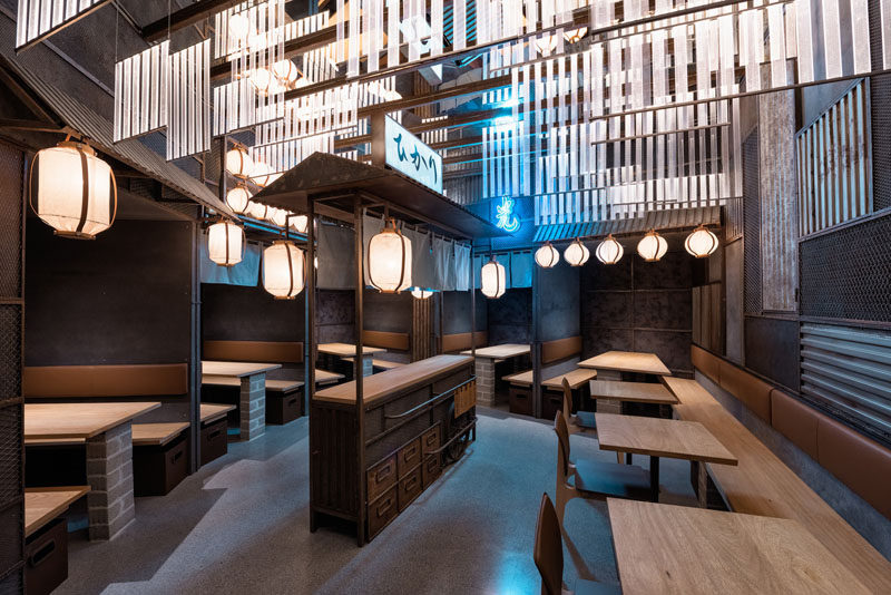 Industrial Interior Design - This Restaurant and bar goes for a warehouse chic style with metal, concrete, and wood. Inspired by Tokyo's nightlife and all the different alleys in famous Tokyo neighbourhoods, Masquespacio has designed Hikari Yakitori Bar - a Japanese restaurant in Valencia, Spain.