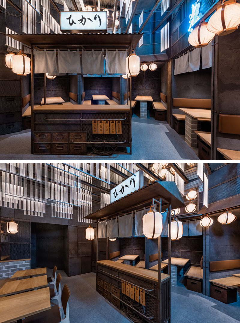 Industrial Interior Design - This Restaurant and bar goes for a warehouse chic style with metal, concrete, and wood. In this modern Japanese restaurant, a small food stand sits in the middle of the dining area to help recreate an authentic dining experience similar to those that take place in Tokyo.