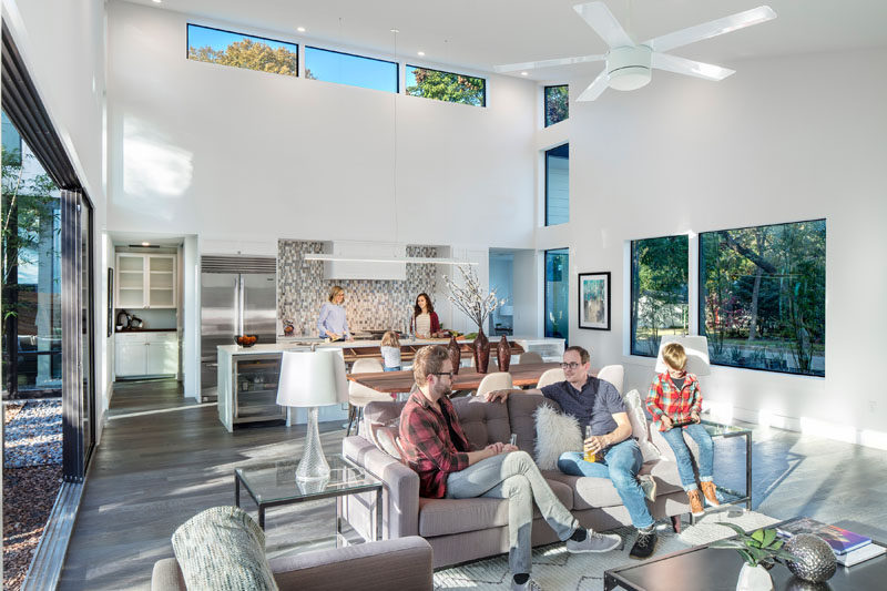 This modern house has an open floor plan with the living, dining and kitchen all sharing the same main room. Tall ceilings made the space feel even larger than it already is.