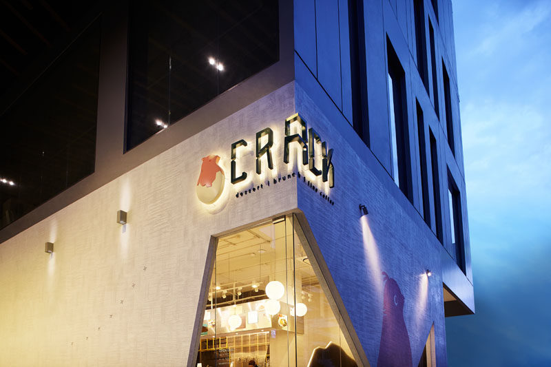 This restaurant logo wraps around the corner of the facade and is backlit, making it easier to read at night.