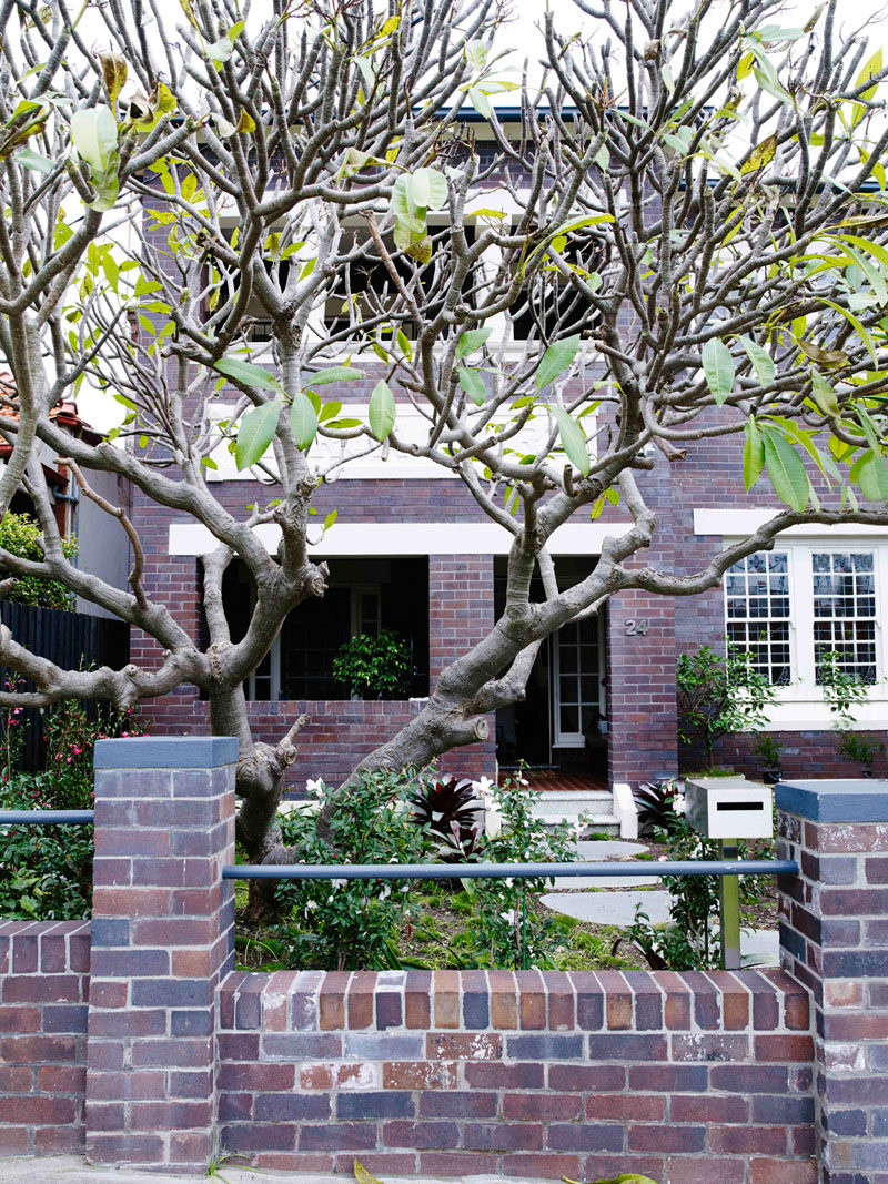 The facade of this 1920s brick duplex apartment building in Sydney, Australia, was modified to kept the same character as the existing building.