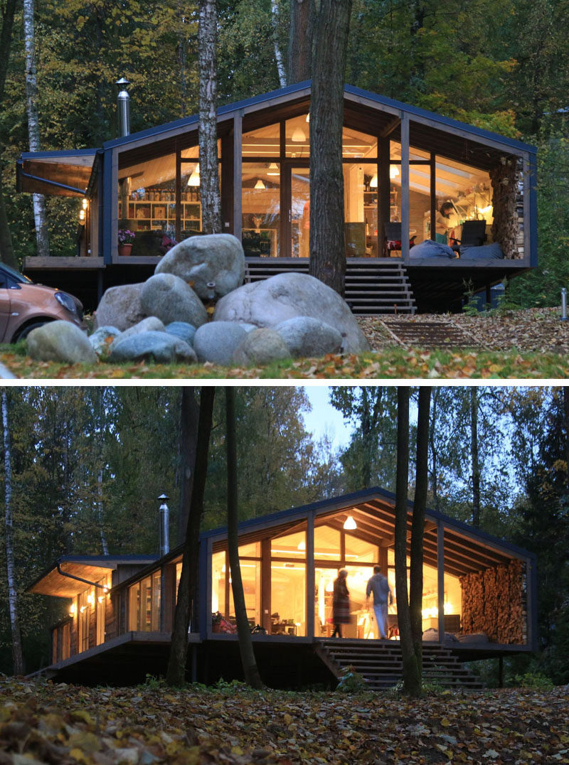 This rustic modern house in a forest has a modular design, with metal framing combined with barn board and glass to create a look that fits in with the surrounding environment.