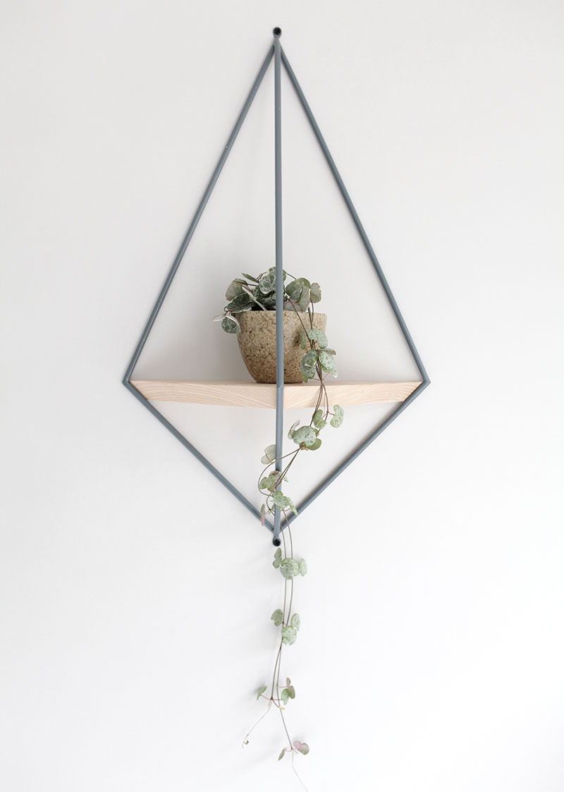 6 Ways To Include Indoor Vines In Your Interior | Draping the vines of a small plant over the side of a unique hanging shelf adds life and color to your space but keeps the look simple and delicate at the same time.