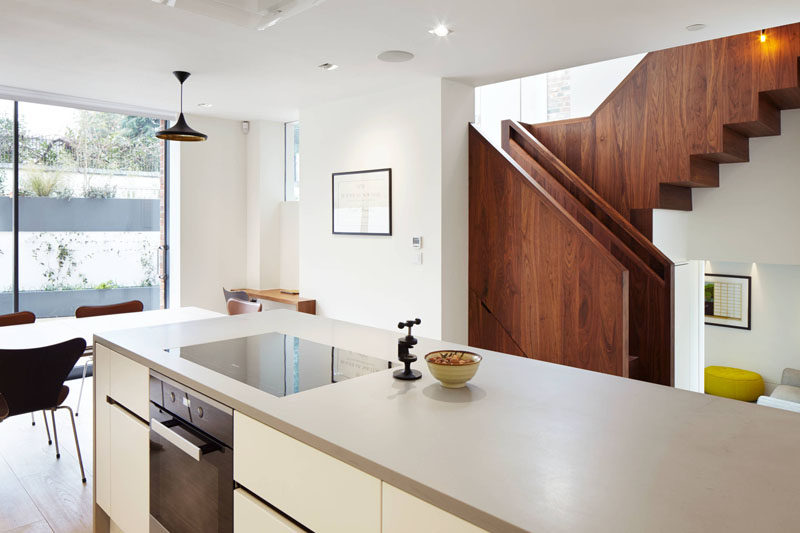 These wooden stairs have a built-in handrail that lights up.