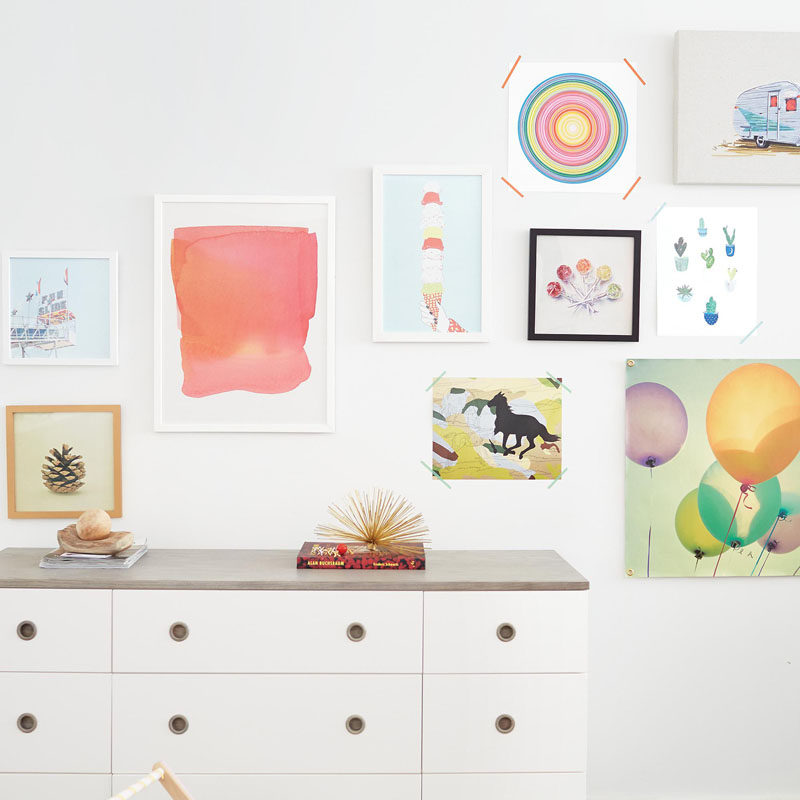 Colorful wall art is a great way to decorate a cute bedroom.