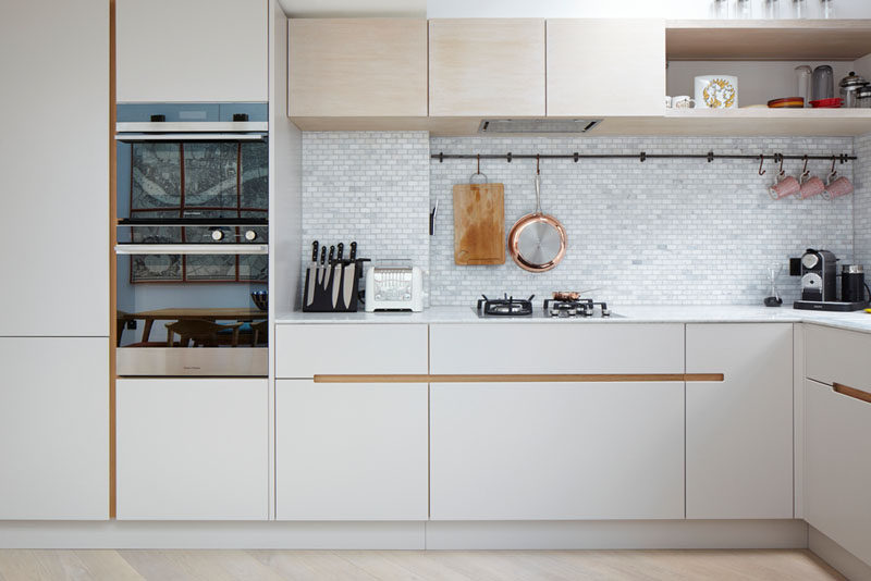 Kitchen Design Ideas - 9 Backsplash Ideas For A White Kitchen // Use marble tiles to create an elegant kitchen backsplash. They come in many different shapes and sizes to give you freedom to create any look you want. 