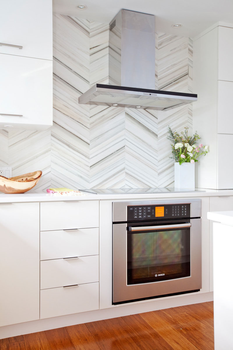 Kitchen Design Ideas - 9 Backsplash Ideas For A White Kitchen // Use marble tiles to create an elegant kitchen backsplash. They come in many different shapes and sizes to give you freedom to create any look you want.