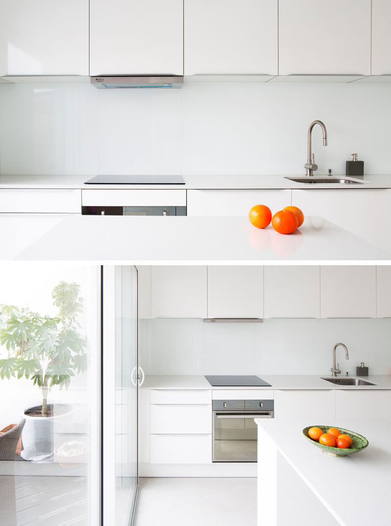 Kitchen Design Ideas - 9 Backsplash Ideas For A White Kitchen // If the all white look is something you really want to stick with, leave the backsplash white. You'll have a completely unified kitchen that's bright, clean, and sure to stand out from the rest of your home.