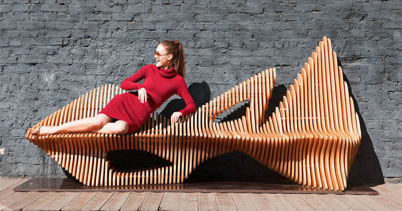 Oleg Soroko has designed an organically shaped, sculptural wooden bench named the Falcon Bench, inspired by the bird of the same name.