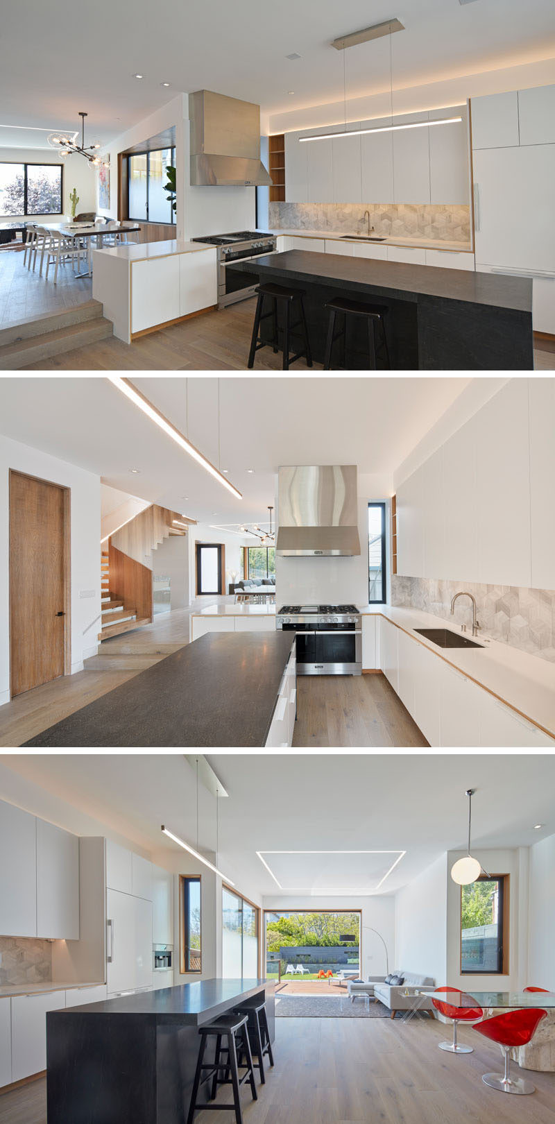 Stepping down from the dining room in this modern house is the kitchen. A large black central island with seating contrasts the white cabinets and countertops, and stainless steel appliances. Off to the side of the kitchen is a small dining nook with red chairs and a glass table.