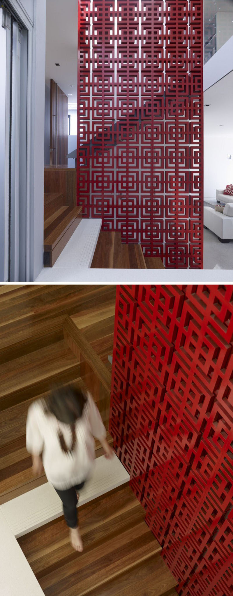 A patterned red safety railing on these wood stairs adds an artistic and bold statement in this modern house.