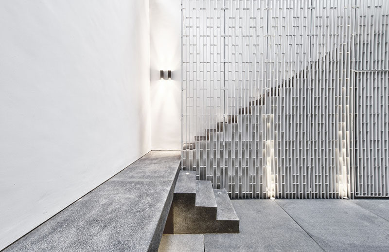 The metal safety railing on these stairs has a vertical pattern and adds dimension to the interior.