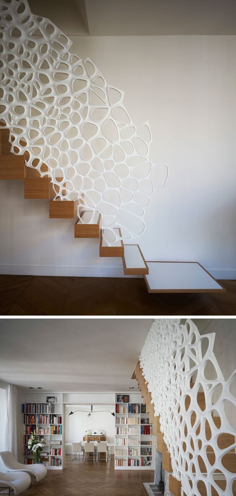 This white sculptural railing running the length of the staircase is made from Corian to make sure it's strong, durable, and able to withstand lots of use over the years.