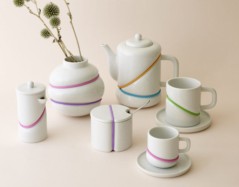 Serve your tea with a pop of color using this rubber band inspired tea set with brightly colored bands that give the set a fun modern look.