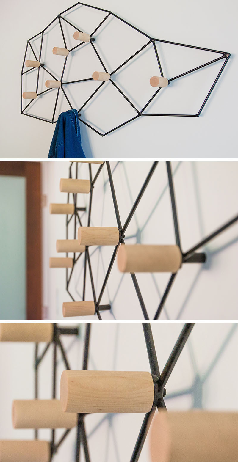 This geometric and modern wall-mounted coat rack could easily pass as wall art, and is made from a black metal frame that attaches to the wall, while wood pegs are positioned at the internal joints, creating a space to hang your jacket, scarf or bag.
