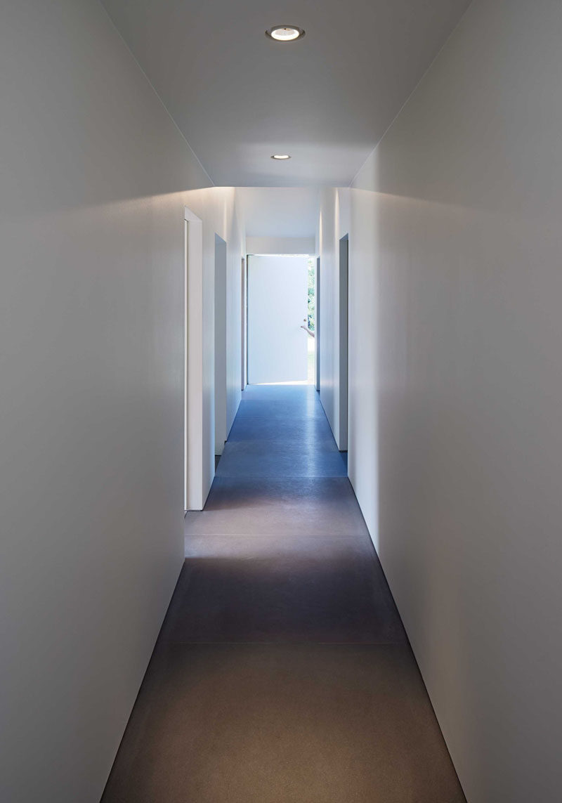 Throughout this modern house, Pietra Serena stone floors have been installed for a nice dark grey appearance that contrast the white walls.