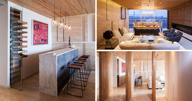 Architectural design studio Taller David Dana (TDDA) have designed this elegant and contemporary apartment that features a formal living and dining room, a bar, and a large wood partitions.