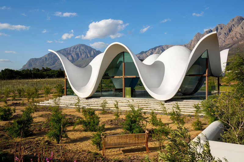 Architecture firm Steyn Studio have designed a sculptural and modern chapel, located within a vineyard in Western Cape, South Africa, that's surrounded by a valley and mountains.