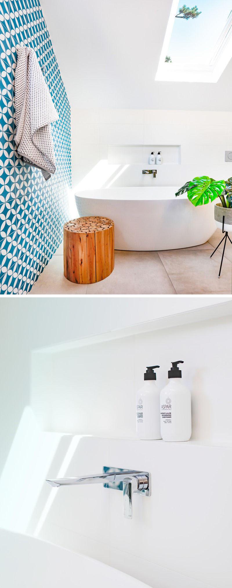 This modern blue and white bathroom has a built-in shelf above the freestanding bathtub to keep all the necessities within arms reach.