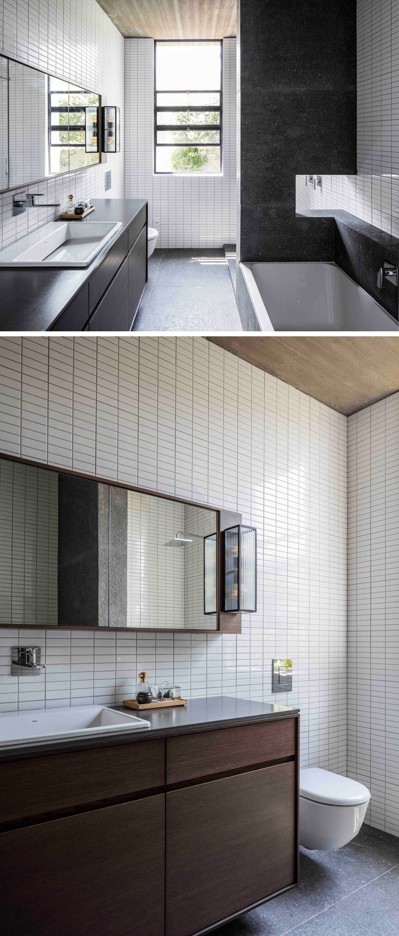 In this master bathroom, small white rectangular tiles cover the walls from floor-to-ceiling, and dark elements like the bath and vanity compliment the black window frames.