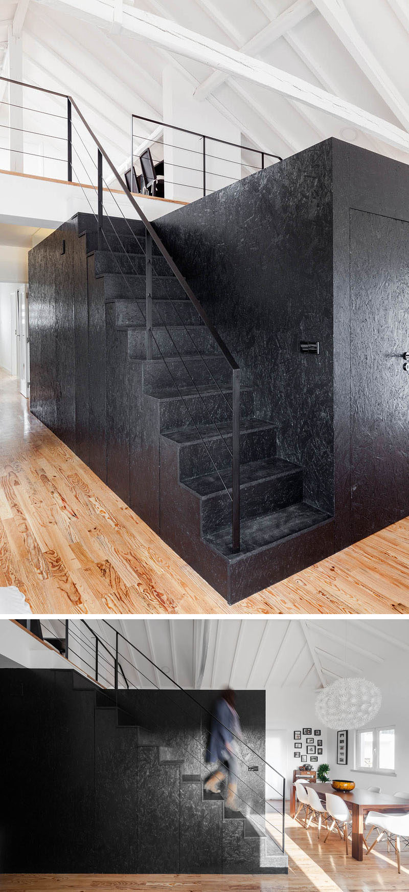 These black stairs attached to a black wooden box, feature hidden storage and lead up to the loft area of this converted barn.